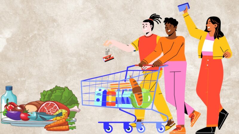 Three diverse individuals joyfully push a shopping cart filled with groceries, including fresh vegetables, dairy, and other food items, while one person holds up a shopping list