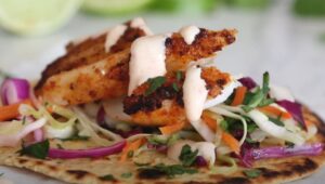 A flavorful fish taco with a creamy sauce