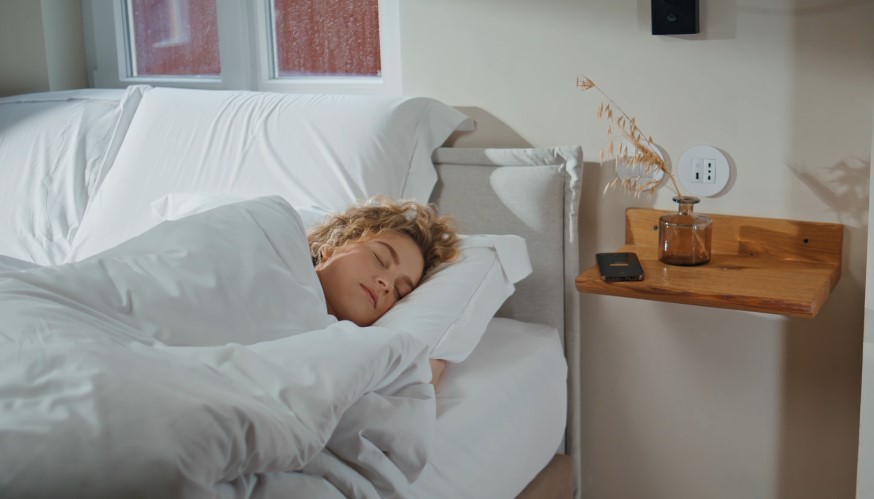 A peaceful scene of a woman sleeping in a comfortable bed