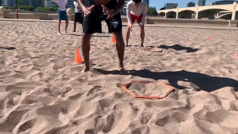 People Training on The Sand, Performing Agility Exercises to Protect Joint Health