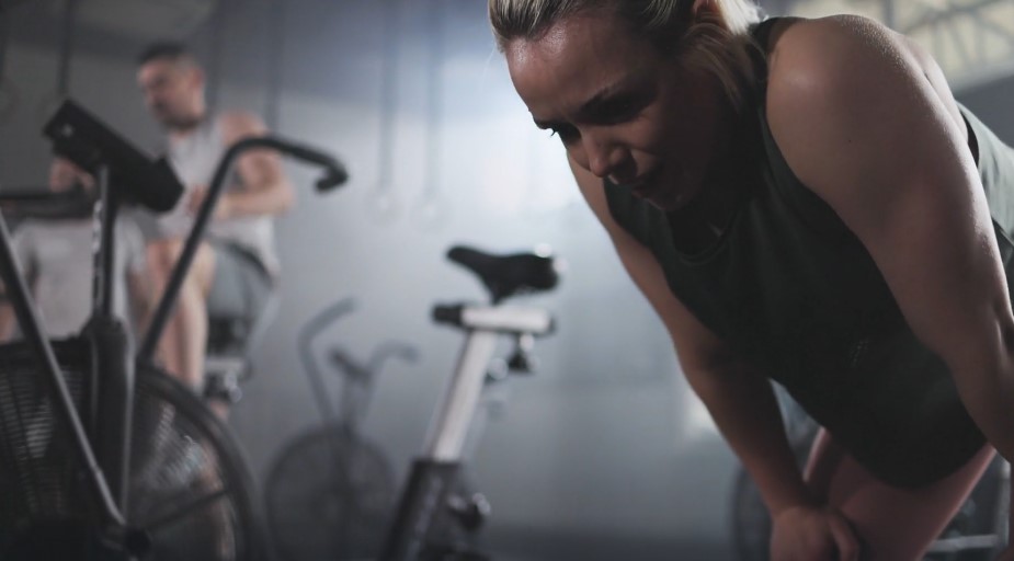 Woman exhausted during gym workout