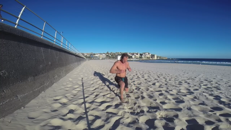 A Person Doing Lunges on The Sand for Injury Recovery and Prevention