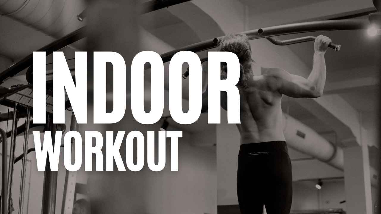 Man doing pull-ups on an indoor gym bar with “Indoor Workout” text overlay