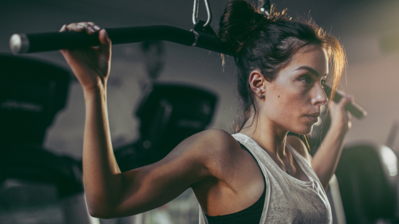 A woman using gym equipment at one of the women-only fitness studios in Miami