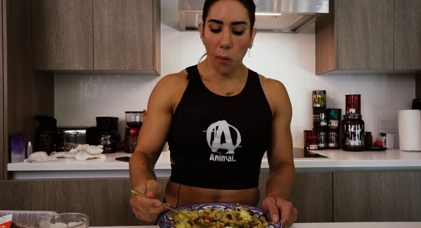 Woman eating food after intense workout