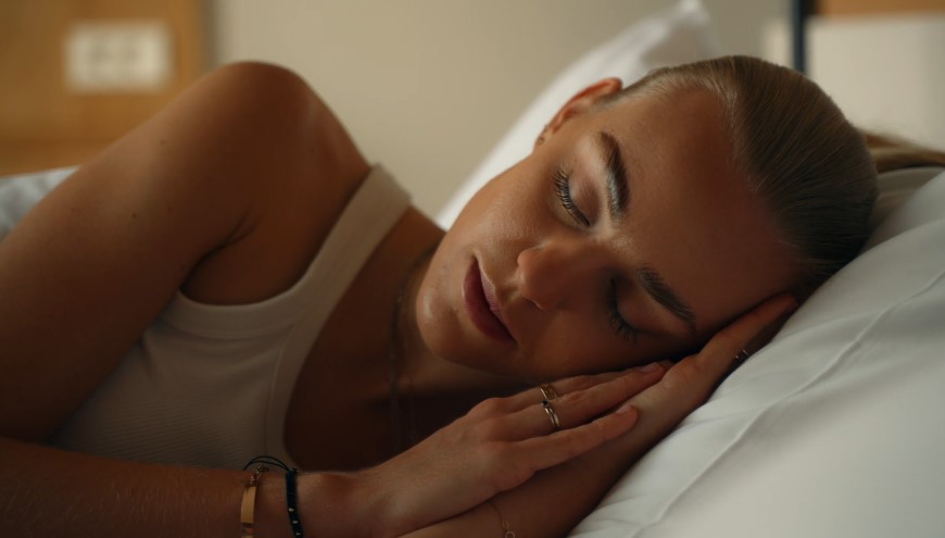 Blonde woman taking a nap after a workout