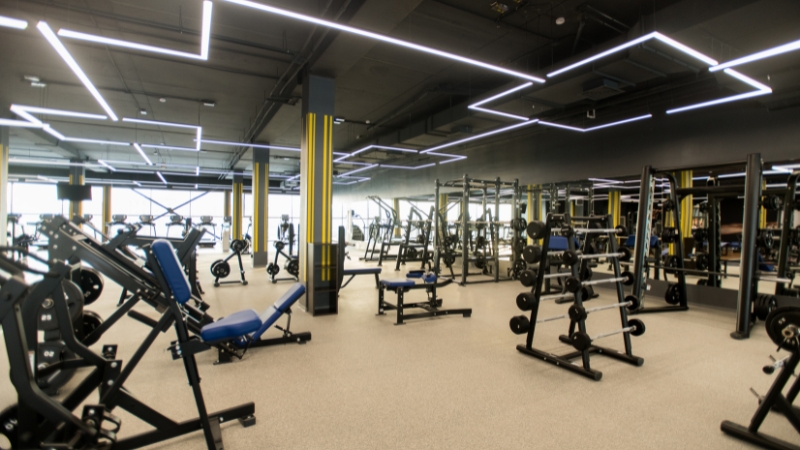 Gym with modern equipment showing what new gym owners must plan before opening