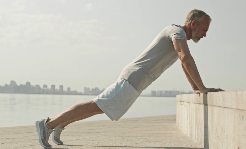 Adult man doing wall pushups