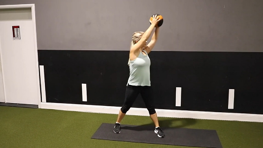 Woodchopper movement with a medicine ball