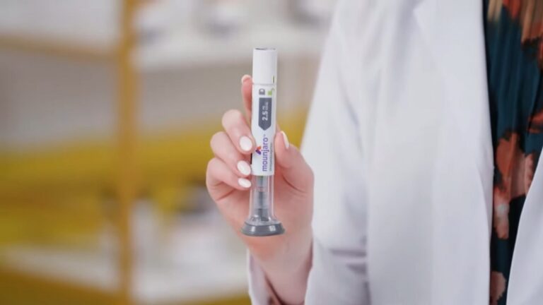 A hand holds a Mounjaro injector pen used in Tirzepatide for weight loss