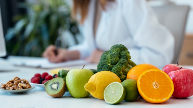 Healthy foods like fruit, vegetables, and nuts prepared for balanced macronutrient tracking