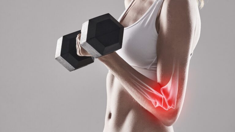 Woman lifting a dumbbell with elbow pain highlighted, showing why bone resilience matters for weight training performance