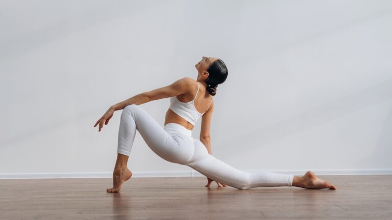 Woman performs a deep stretch on the floor to support joint health and posture
