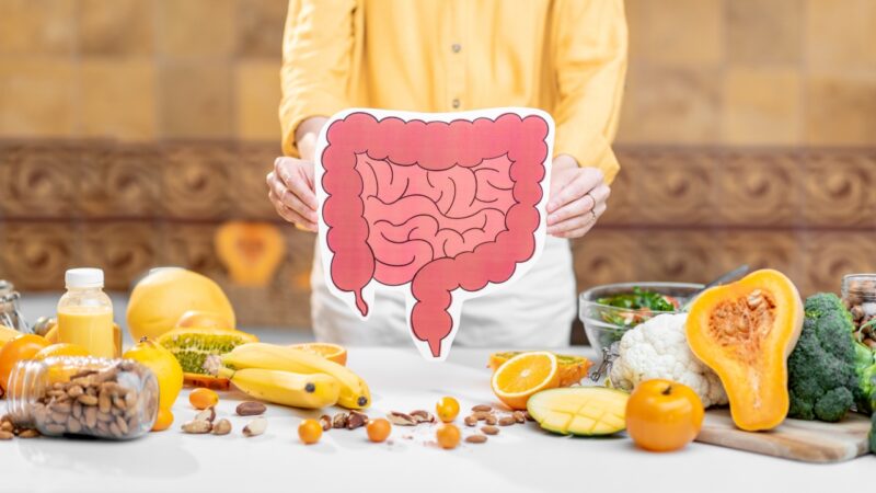 Morning routine for gut health shown with food and digestive system illustration