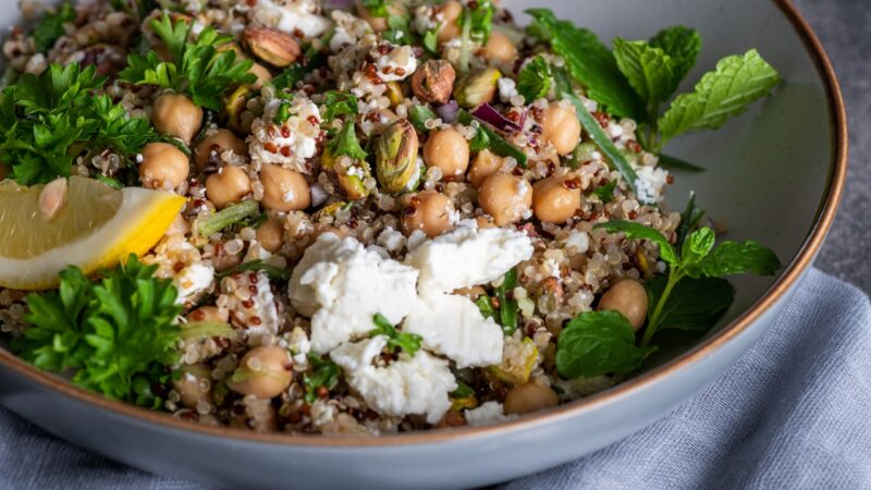 Quinoa salad with chickpeas, herbs, and nuts as plant-based protein food