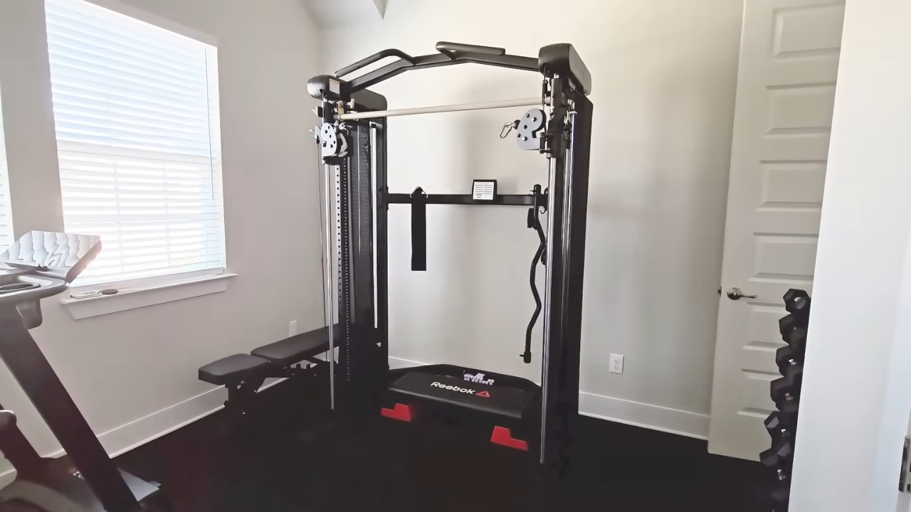 Compact cable strength machine set up in a small home gym